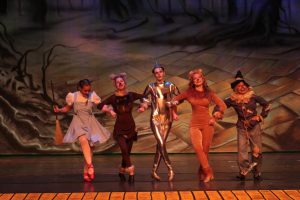 The Cast B leads link arms and dance. (left to right) Breanna DePinto, Makenna Croxton, Alexa Artino, Gracie Dyer and Chloe Dotson
