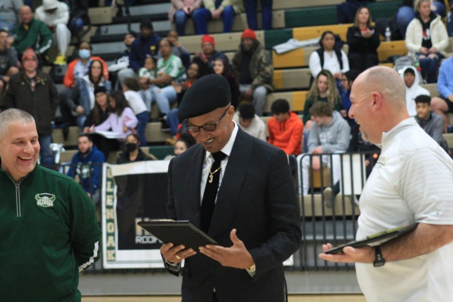 CJ and Erickk McCollums father, Erickk Sr., accepting the brothers plaques.