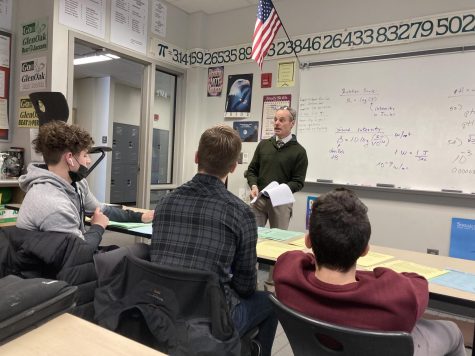 Adviser Matt Brown instructs the TEAM+S engineering competitors on their upcoming essay. Students from left to right include: junior Zachary Brown, senior Brody Fravel and junior Roman Shaheen.
