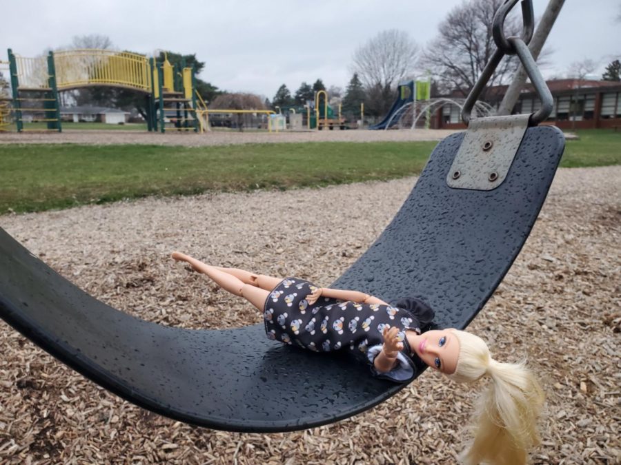 A Barbie Doll sits on a swing at the montessori school on 55th Street. Childhood goes by quickly and it is often difficult for parents to adjust.