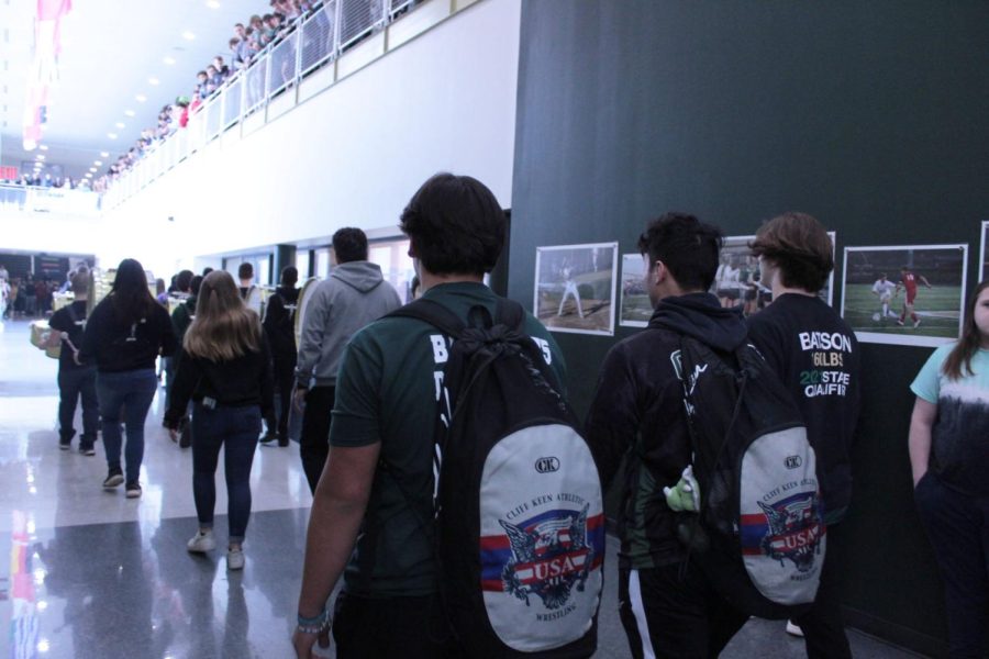 Wrestlers Romeo Magueyal, Ronnie Dimmerling and Brandon Batson walking in their send off to states. 