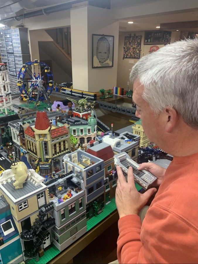 Scott Brown looking over his Lego collection. I dont know how many buildings I have. A lot, Brown said. 