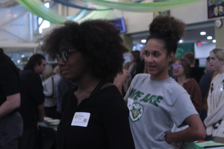 Sophomore Zaria Fink (left) listens closely as a college advisor gives details on how to start applying. It was really neat, all of these different colleges, I think around fifty showed up. It was crazy, Fink said.