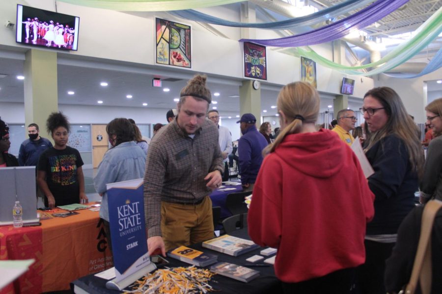 A representative from Kent State Stark talks to a student during the Stark County College Fair held on Oct. 5 at GlenOak High School.
