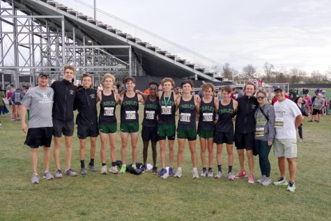 Coach Bryan Krosse, Jacob Harms, Brandon Harper, Braedon Paolini, Canaan Sommers, Tesfaye Young,  Tommy Rice, Wesley Marsden,  Ryan Bridenthal, Sean Lynch, Andrew Harold, coach Amanda Wightman, and coach Mark Mazzaferri at the State Cross Country Meet on Nov. 5.  “What helped the team get to the state meet was coach Krosse’s emphasis on being the grittiest team on the course from day one of practice. This focused each runner on doing their best even when sick or sore and not letting their teammates down,” Mazzaferri said. 
