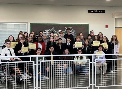 The team gathers together to take a photo after a successful novice tournament at GlenOak highschool. The team finished with 8 people placing.