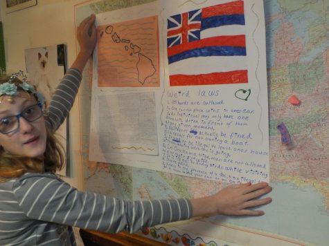 Pictured is now senior, Grace Flock, when she was thirteen. She is presenting her geography project on Hawaii to her geography homeschool group. 