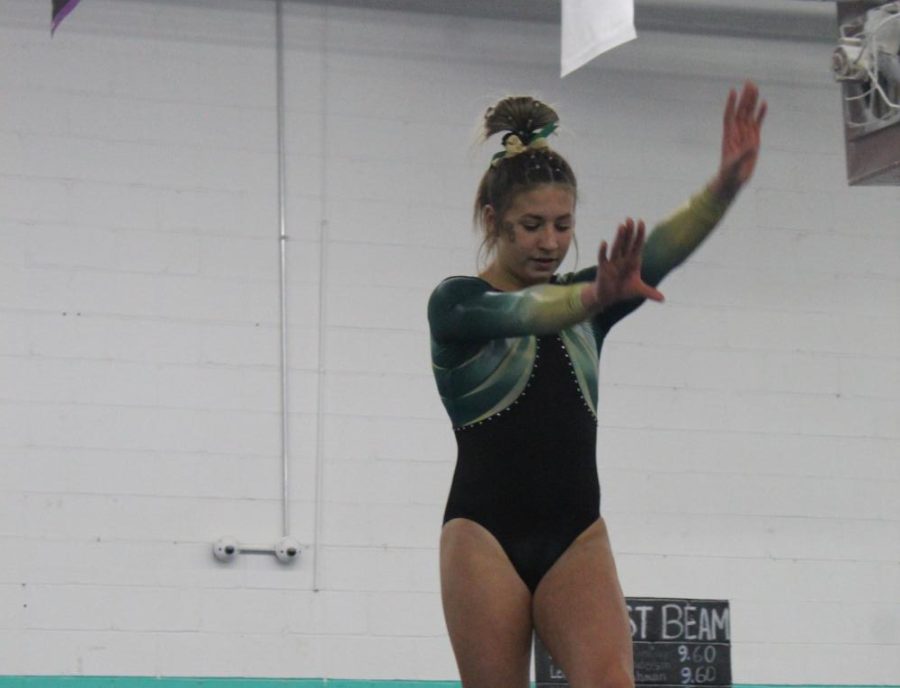 Brooklyn Maurer prepares to complete a backflip while competing on beam