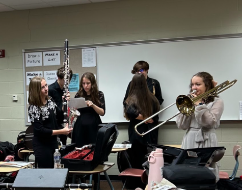 Pictured left to right Junior Mari Lyke, Senior Nate Davis, Sophomore Katherine Cook, Junior Daytona Rodgers, Sophomore Carter Sterling, and Junior Katelyn Dentler prepare to perform at OMEA Solo and Ensemble Competition at McKinley high school on Jan. 14th, 2023.
