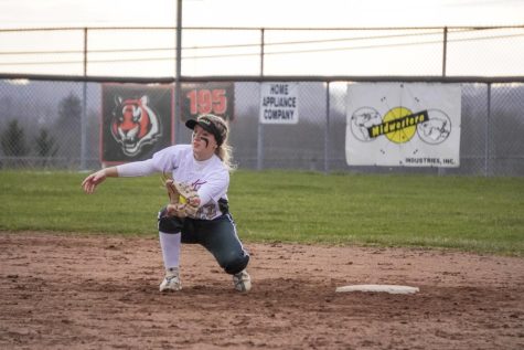 Senior Paige Lucas fields the ball against Massillon to get the out. 