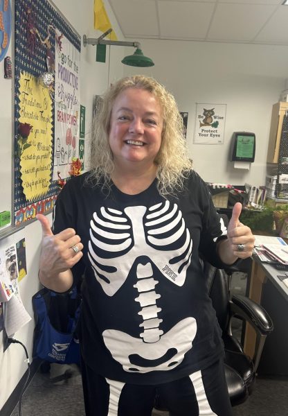 Biology teacher Dori Hess gets into the spirit of Halloween with her skeleton costume.