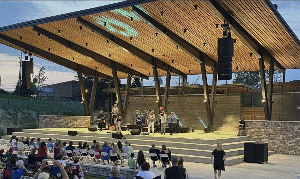 Starting Strong: Musical group Brass Transits perform as the first concert in the new amphitheater. They were part of Plain Township’s Thursday Night concert series.  The new amphitheater and renovations to Oakwood Square are examples of the economic hub Plain Township has been working on. 