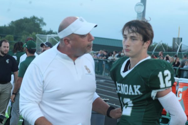 Scott Garcia is seen talking to Cole Anderson about the last offensive drive in a game against Lake. 