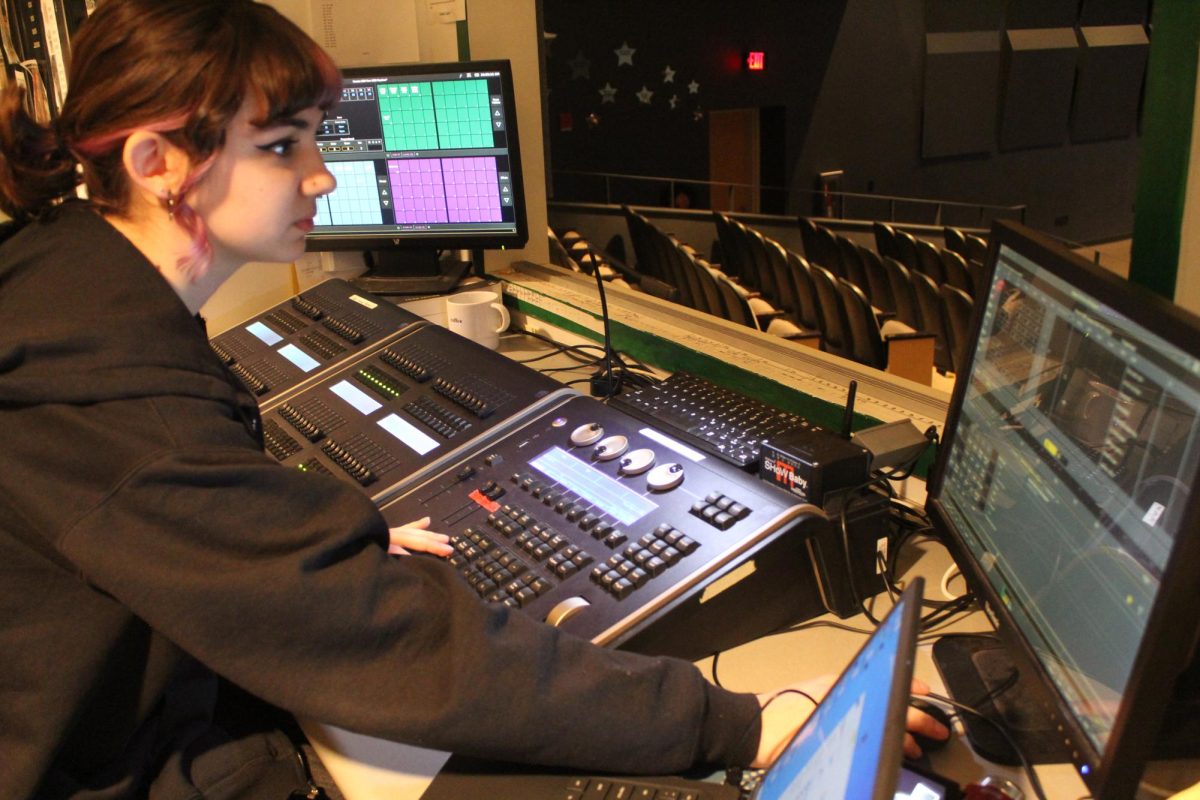 Junior Cora Bankert is pictured above operating a light and sound system. 