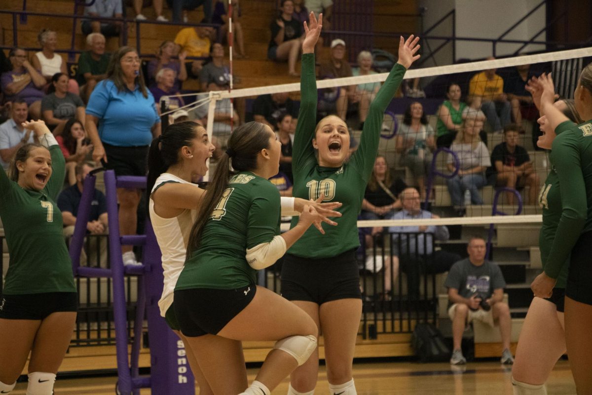 Junior Kaitlyn Wilson, Sophomore Maya Smith and Senior Mackenzie Ging after Wilson laid down a kill.