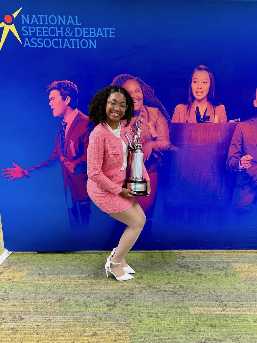 SEnior Jekhia Ballard poses with her trophy at nationals this summer.  Ballard was runner up in spoken word. 