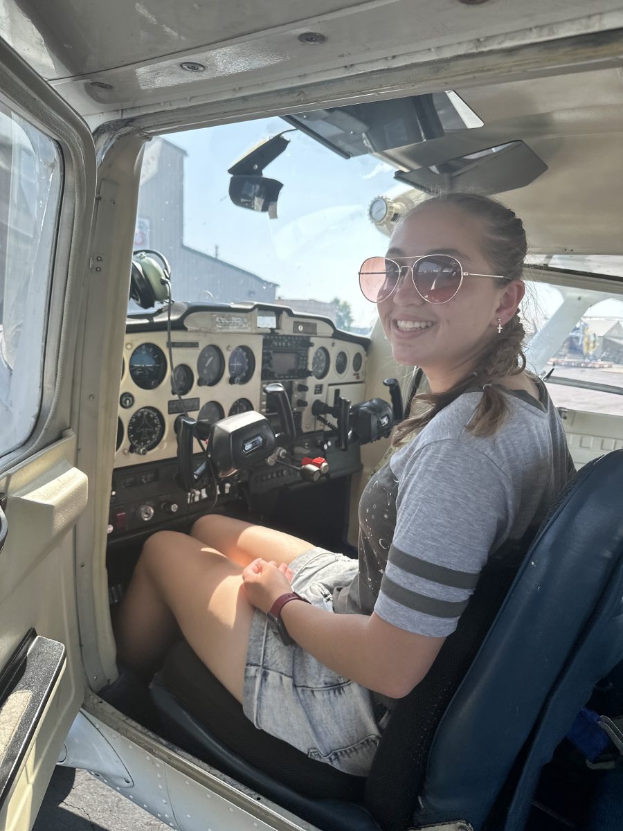 Rennecker sits in the cockpit of a Cessna 150