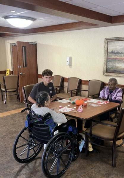 Feeling Lucky: Senior Tony Jeffries participates in bingo alongside two Divine Nursing Home residents 