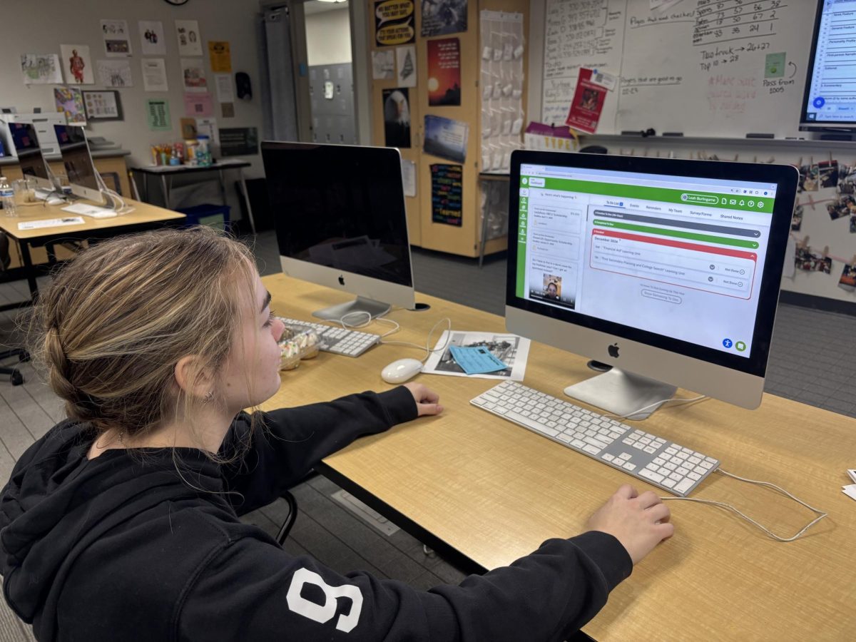 Senior Leah Burlingame works on her SchooLinks account.  Burlingame used SchooLinks to organize her letters of recommendations this year. 