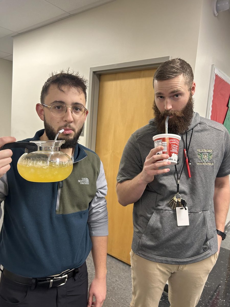 Teachers Joseph Albanese and Drew Shreve drink out of a coffee pot and cottage cheese container. "It was just in my house; I found it on top of my cabinet," Albanese said. 