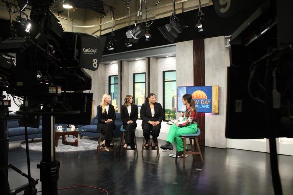 Seniors Kamdyn Hershberger, Emily Clark and Eva Winn being interviewed by Fox 8 News anchor Mackenzie Rossero