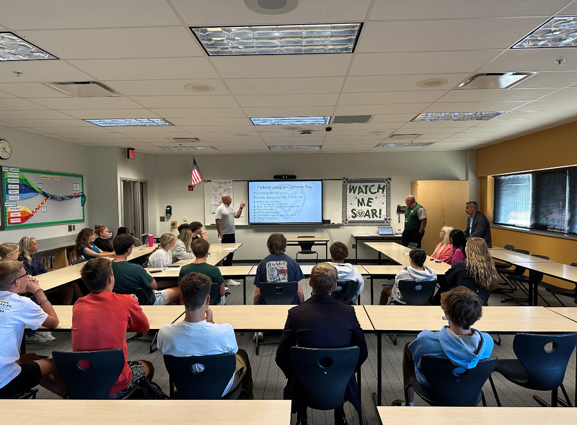 Administrators speak to team captains in the fall.  Athletics hope the team captains meetings unifies sports teams in the high school. 