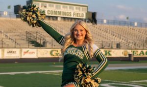 Anna McClure proudly represents the GlenOak cheer team