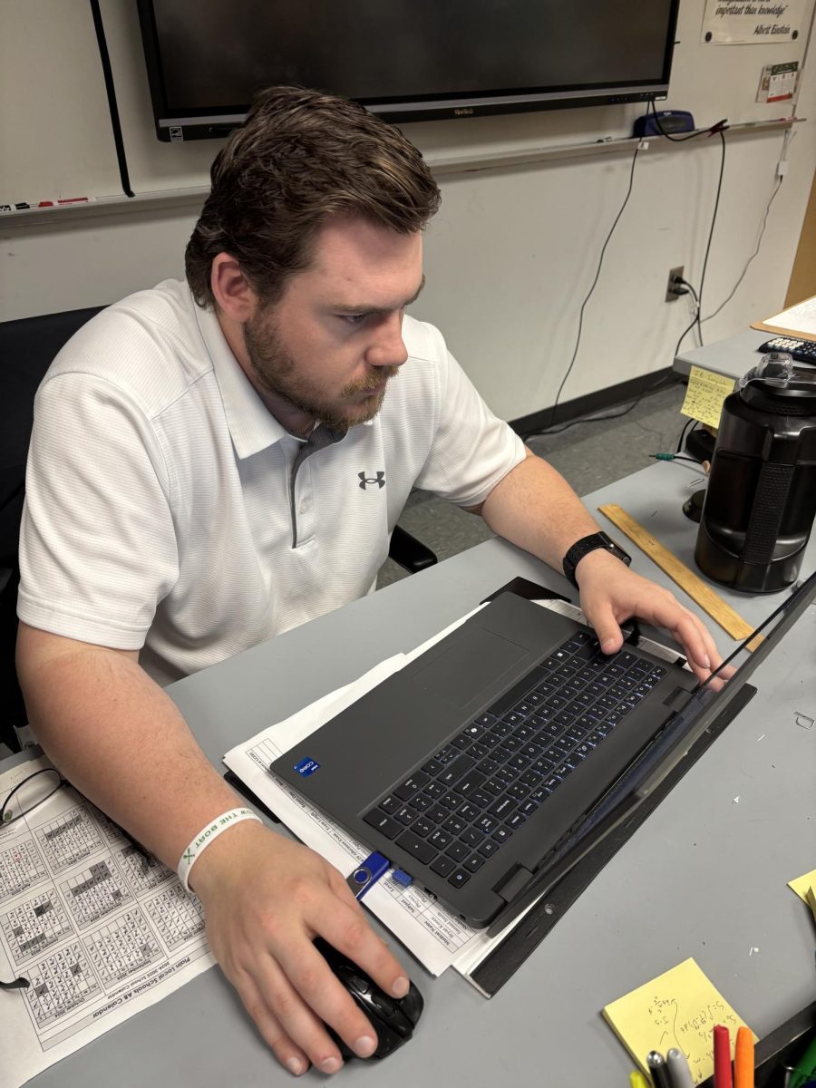 McAdams is shown locked in on creating practice exams for his AP students.