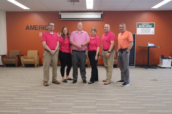 The staff wore pink on Wed. May 21 to celebrate the retirement of freshman principal Scott Esportie.  Pictured left to right are principals Jared Buck, Debra Pickering, Scott Esporite, Gayle Kimbrough, Tyler Adkins and Brett Niarchos.