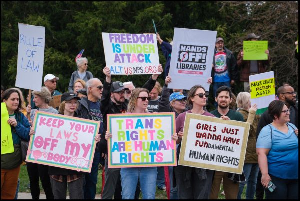 Demonstrators protest at the Akron Apr. 5th Hands Off protest. Over 1,500 people attended the Akron protest, and an estimated three million attended across the nation. These protests were designed to protest President Donald Trump's policies such as tariffs, government cuts immigration.
