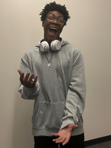 Leon Curry enthusiastically performs the 6-7 hand sign.