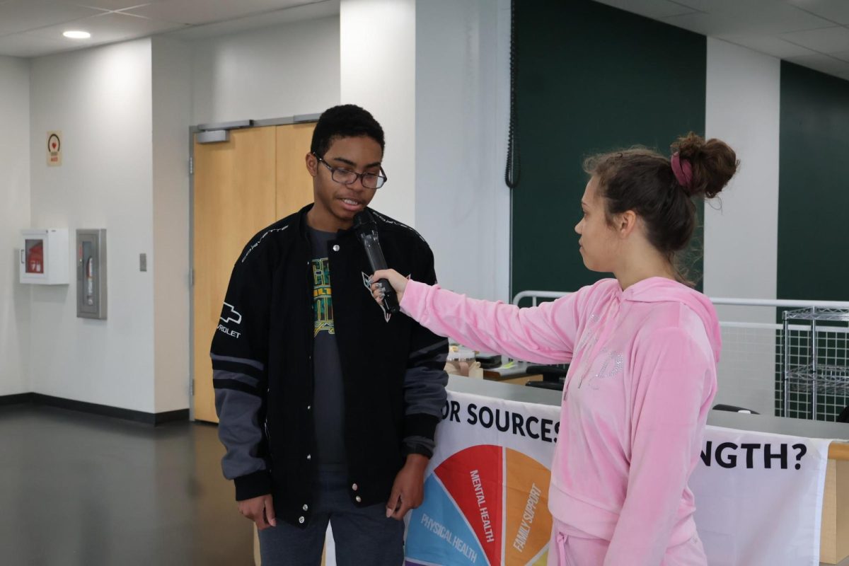 Junior Sean Pendleton is interviewed by graduate Lexi Mitchell last year during Sources of Strength Week.
