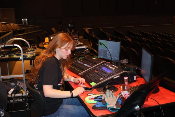 Senior Lilly Wightman patches lights in preparation for last year's musical.