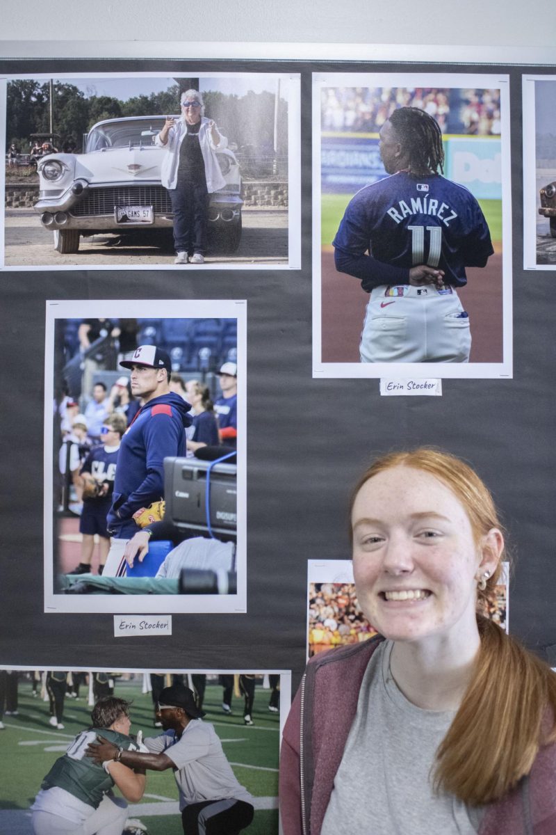 Erin Stocker shows off some of the photos she took at a Cleveland Cavaliers game.