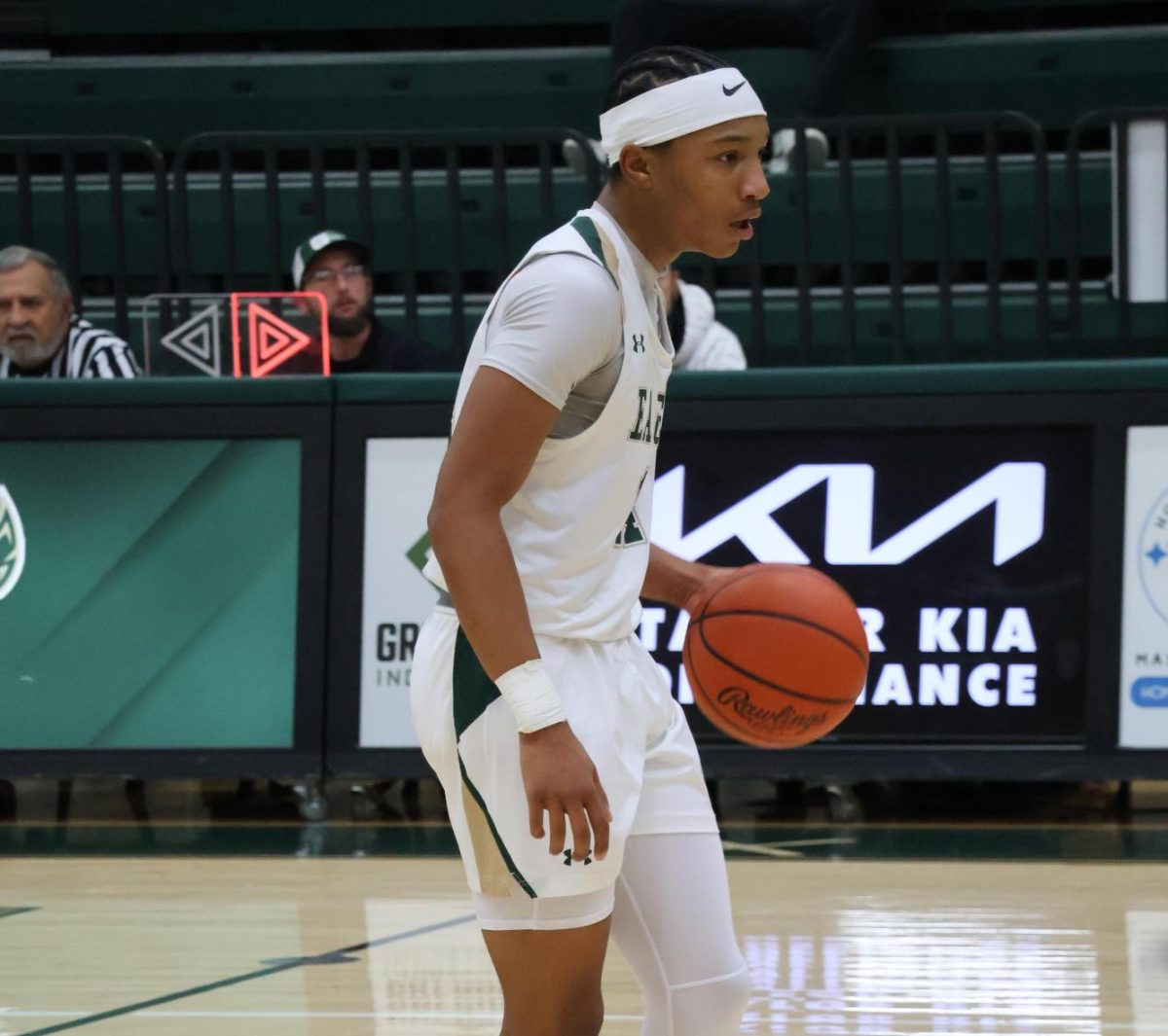 Sophomore Chayse Williams dribbles past half-court.  Williams thinks it helps young athletes with payments but could also bring unwanted attention. 