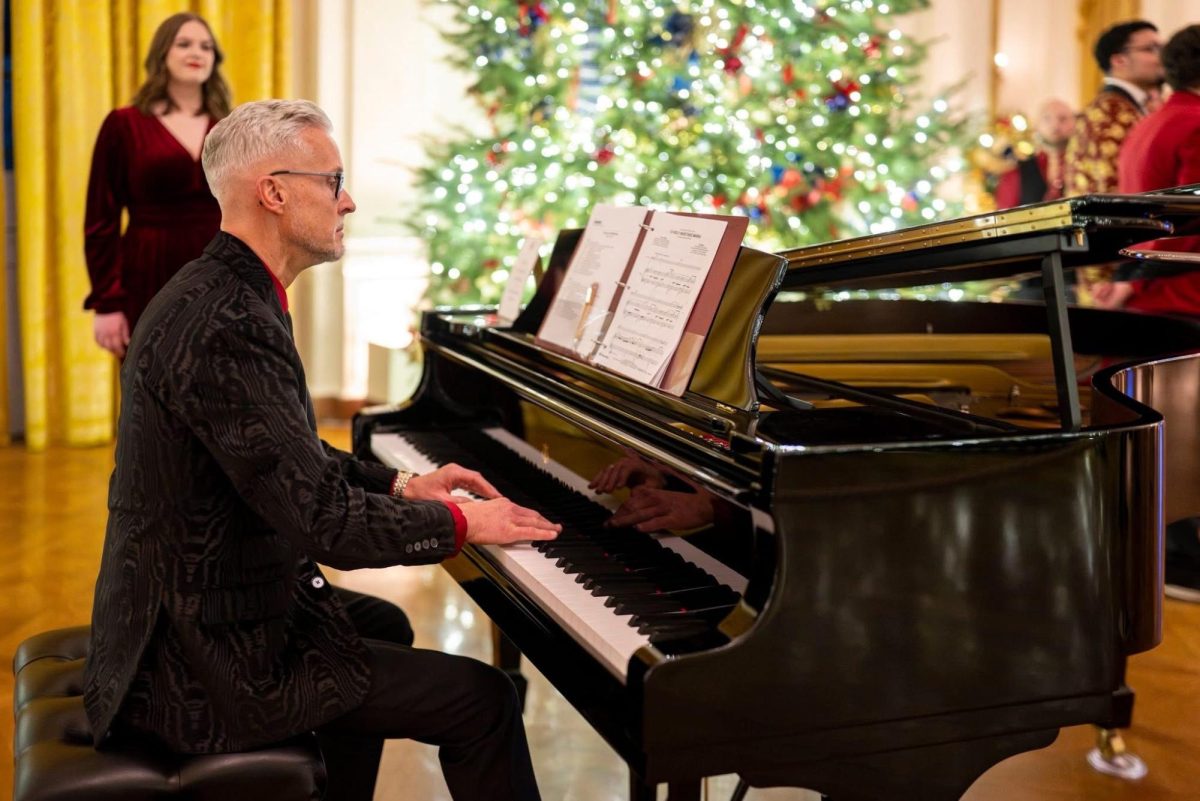 Choir director Brian Kieffer plays on a grand piano in the White House.  Kieffer was performing with the group Vocal Fusion.   