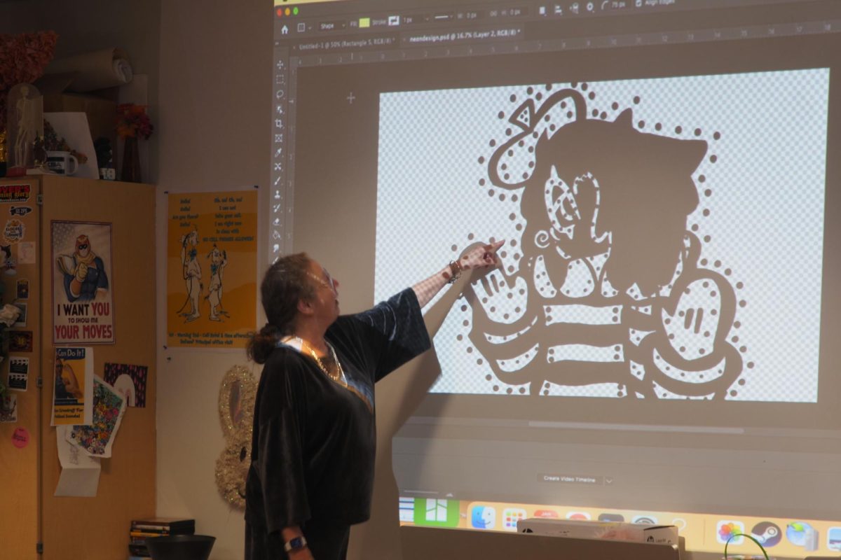 Teacher Paula Patterson teaches her students Photoshop during her career tech class.  Patterson has had many different careers. 