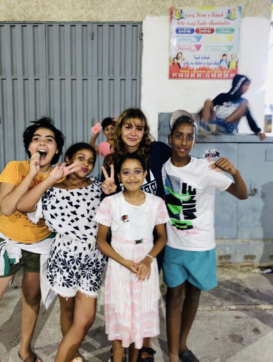 Senior Jasmin Akhrid with the children she met during her time in Morocco 