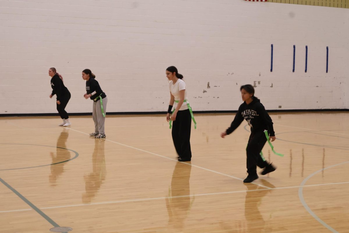 Averie Bickel, Trinity Vinson, Gianna Miller, Jadherlyn Ordonez at flag football practice.