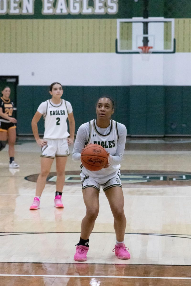 Sophomore Lauren Thomas completes a free throw during the girls basketball season. 
