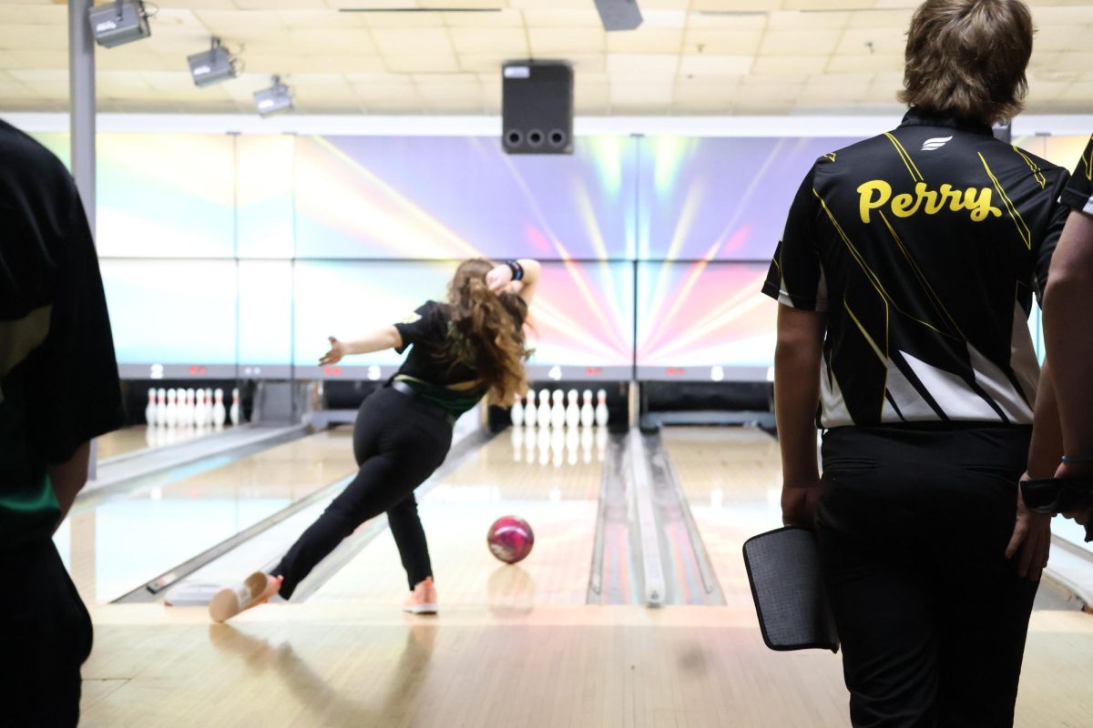 Freshman Mikayla Tucker completes a shot during a regular season match against Perry.  Tucker will compete in the State Bowling Tournament. 