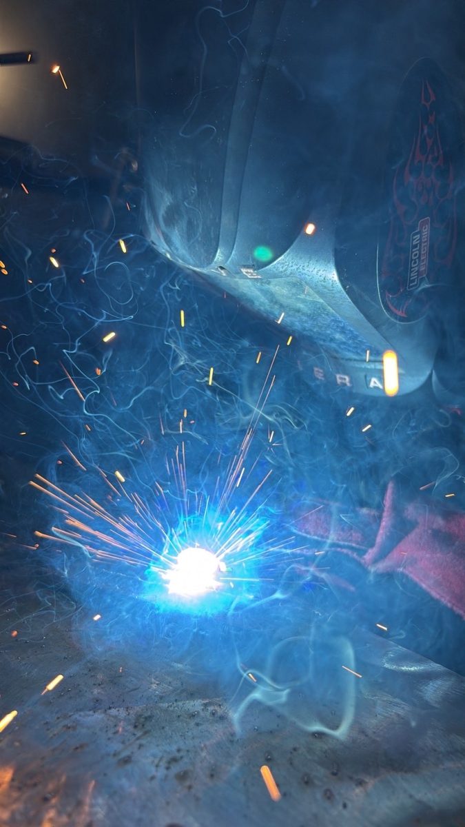 Junior Laila Cindric welds during her class.