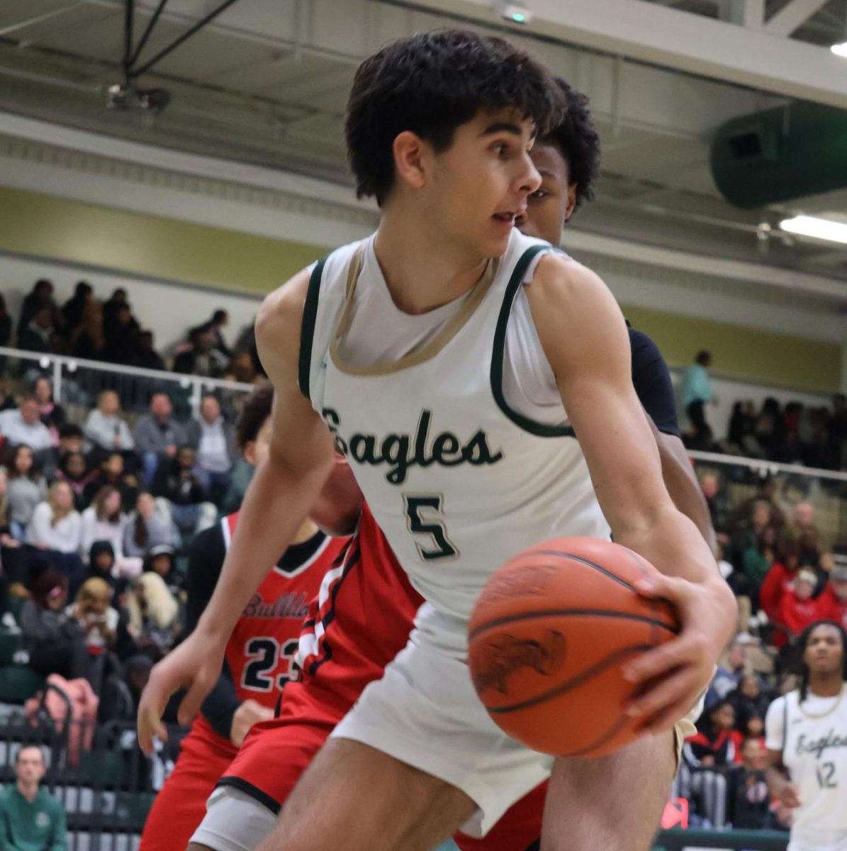 Junior Jaxson Kendrick tries tires to break free during the McKinley Basketball game.  