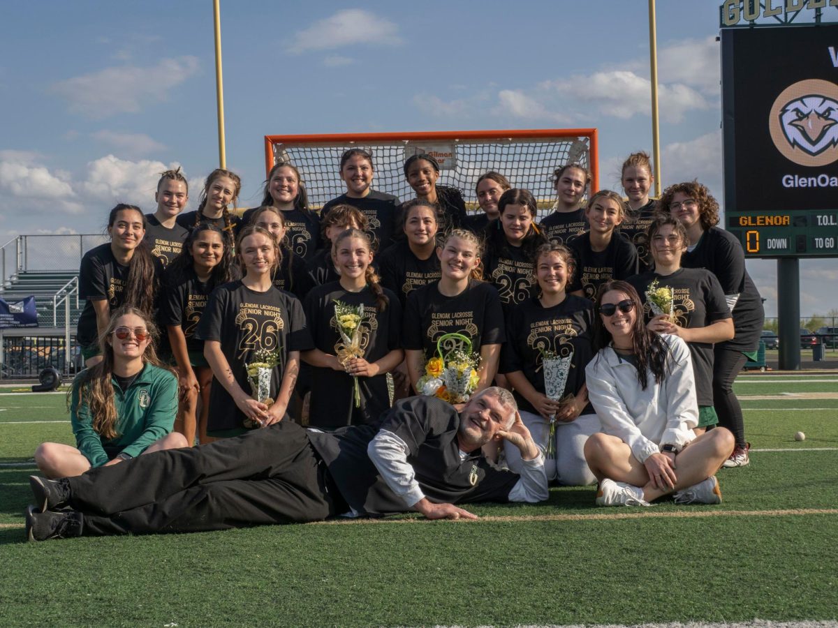 The girls lacrosse team on senior night. May is a recent addition to the coaching staff. 