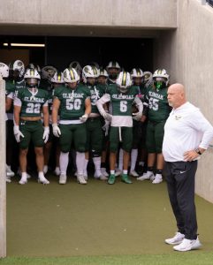 Scott Garcia gets ready to lead the football team out at the Pro Football Hall of Fame. Garica will retire at the end of this school year.