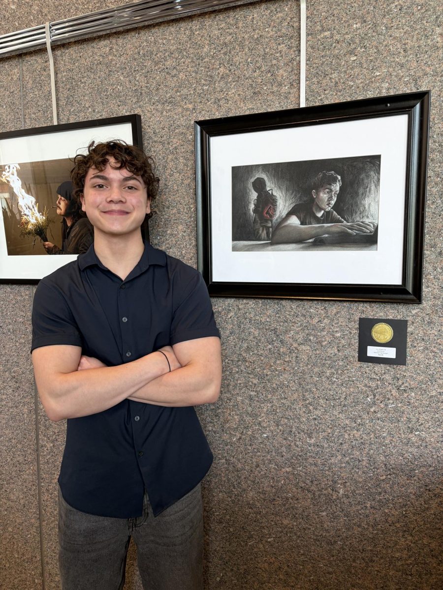 Lon Wright pictured with his artwork.  Wright accepted the Top 25 Medal and award certificates of achievement for his four works of art selected for this Ohio Governor’s Youth Art Exhibition. Additionally, Lon received a $1300 scholarship to attend a 3-week art camp at the Art Academy of Cincinnati this summer. 
