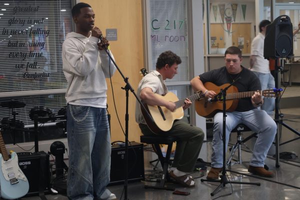 Jayden Starks, Josh Jacobs, and Jacob Miles play during the commercial photography portfolio show last week. 