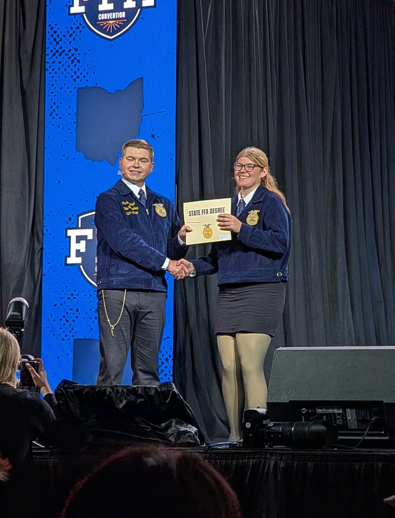 Senior Daisy Theodore accpets her awards at the FFA State Convention.  Theodore placed 10th in the competition. 